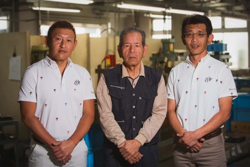 Katsuhiro Miura, alongside his sons, Yoshitaka, left, and Shinei, right